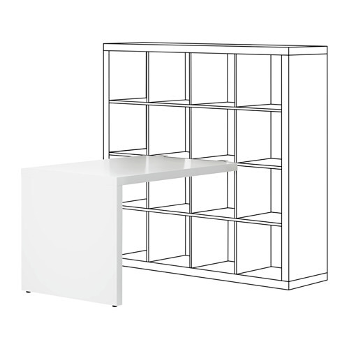 White add-on desk attached to a large open shelving unit with compartments.