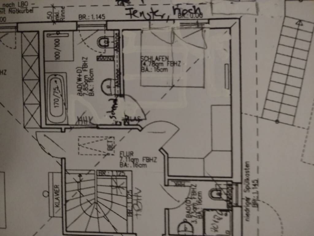 Floor plan showing bathroom, bedroom, living room with piano and stairs