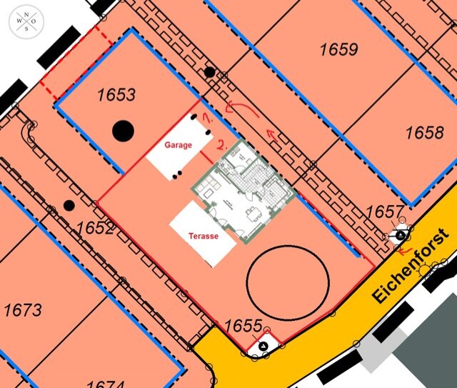 Site plan of a building plot with garage, terrace, and building layout.