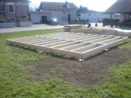 Foundation frame on a construction site with metal frame, earthy surroundings and open space