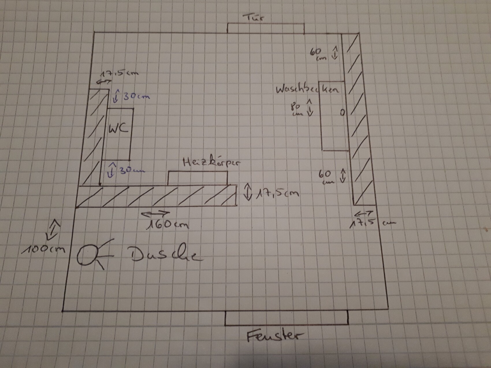 Floor plan of a bathroom with toilet, shower, sink, window, and radiator.