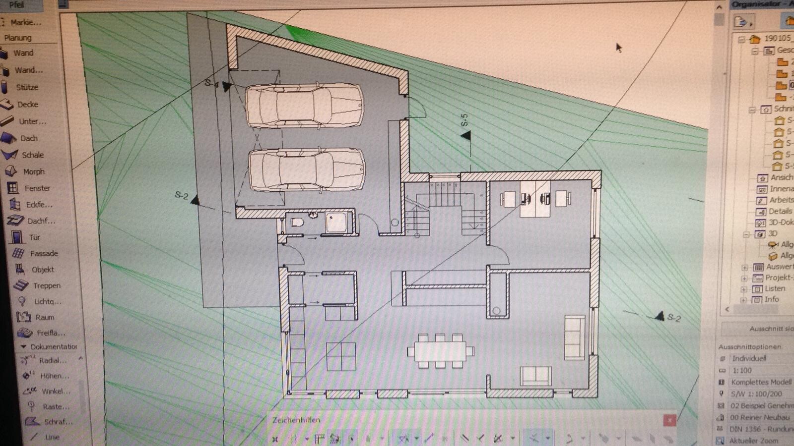 Floor plan of a house with double garage, stairs, and open living and dining area.