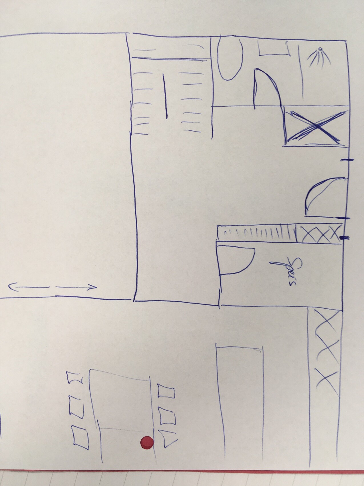 Hand-drawn floor plan sketch of a house with living room, kitchen, and dining area
