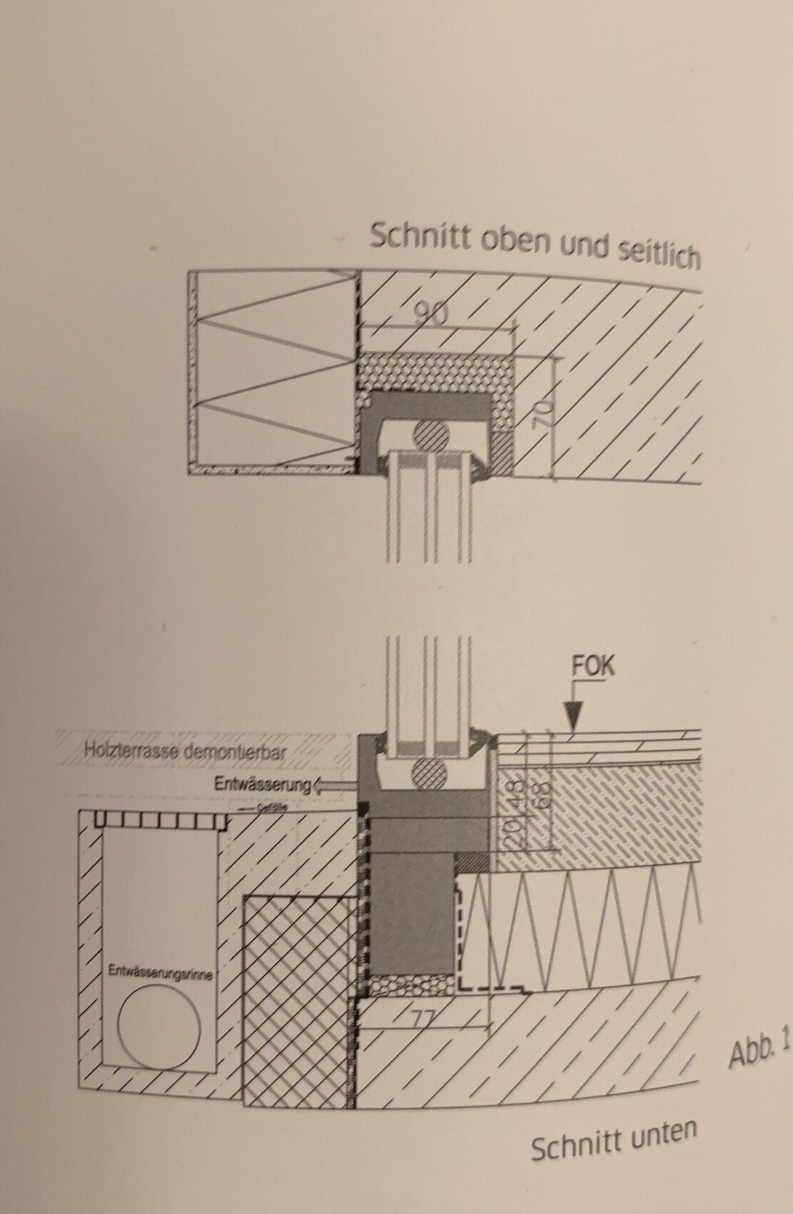 Cross-section through a wall and terrace construction with insulation and drainage.