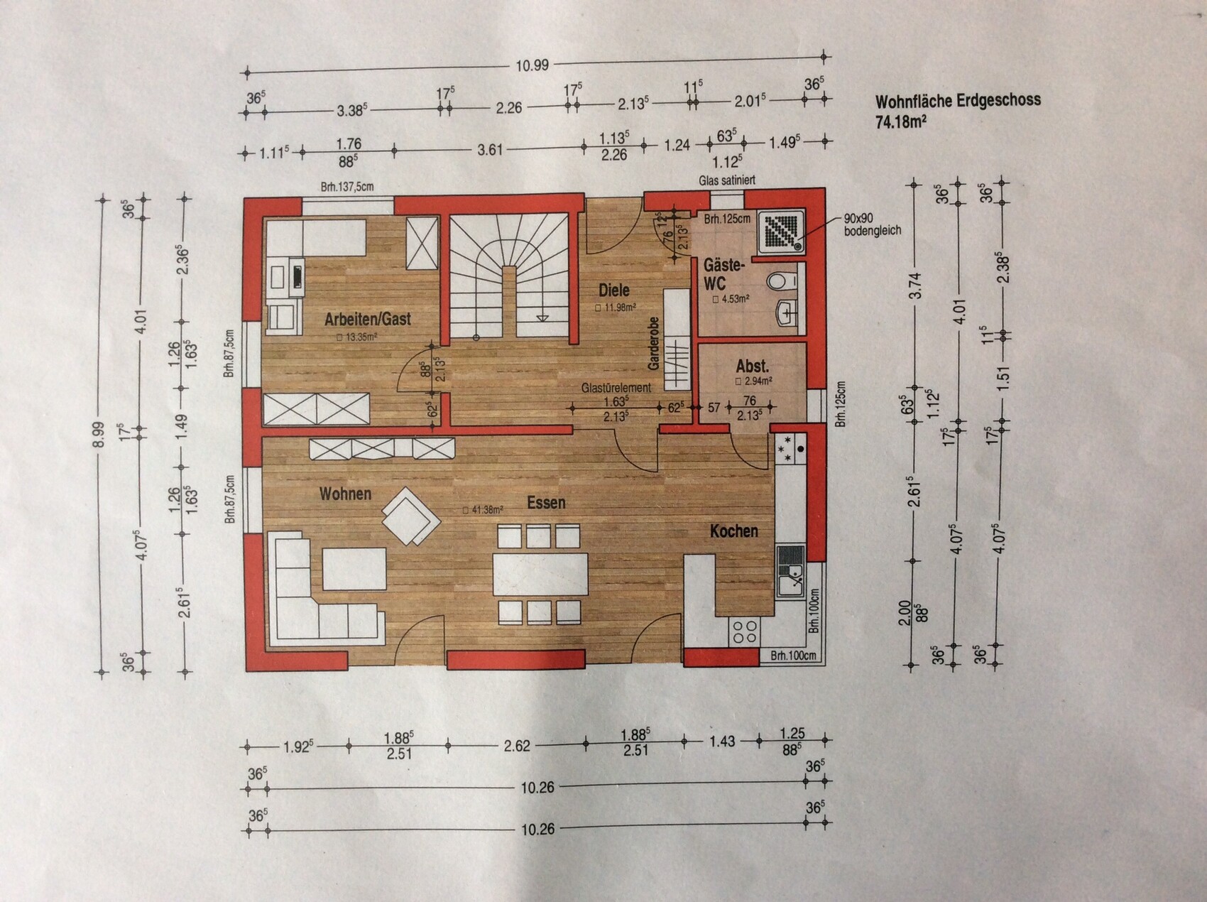 Ground floor plan with living room, dining area, kitchen, hallway, guest toilet, and storage room