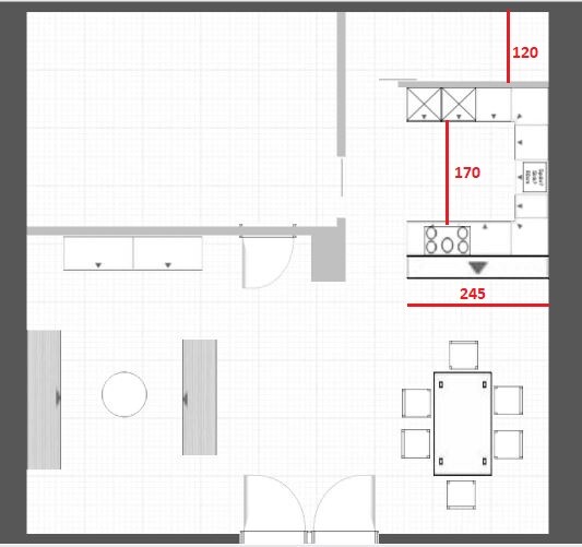 Floor plan of kitchen and dining area: Dining table on the right, kitchen unit, round table on the left, entrance at the bottom.