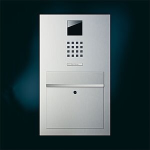 Modern metal intercom panel at the house entrance with mail slot