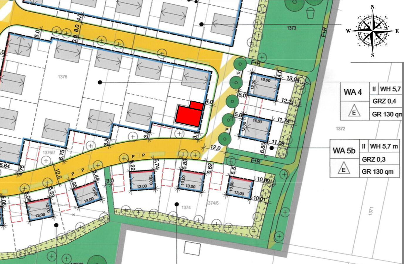 Site plan of residential area with red building plot and surrounding streets