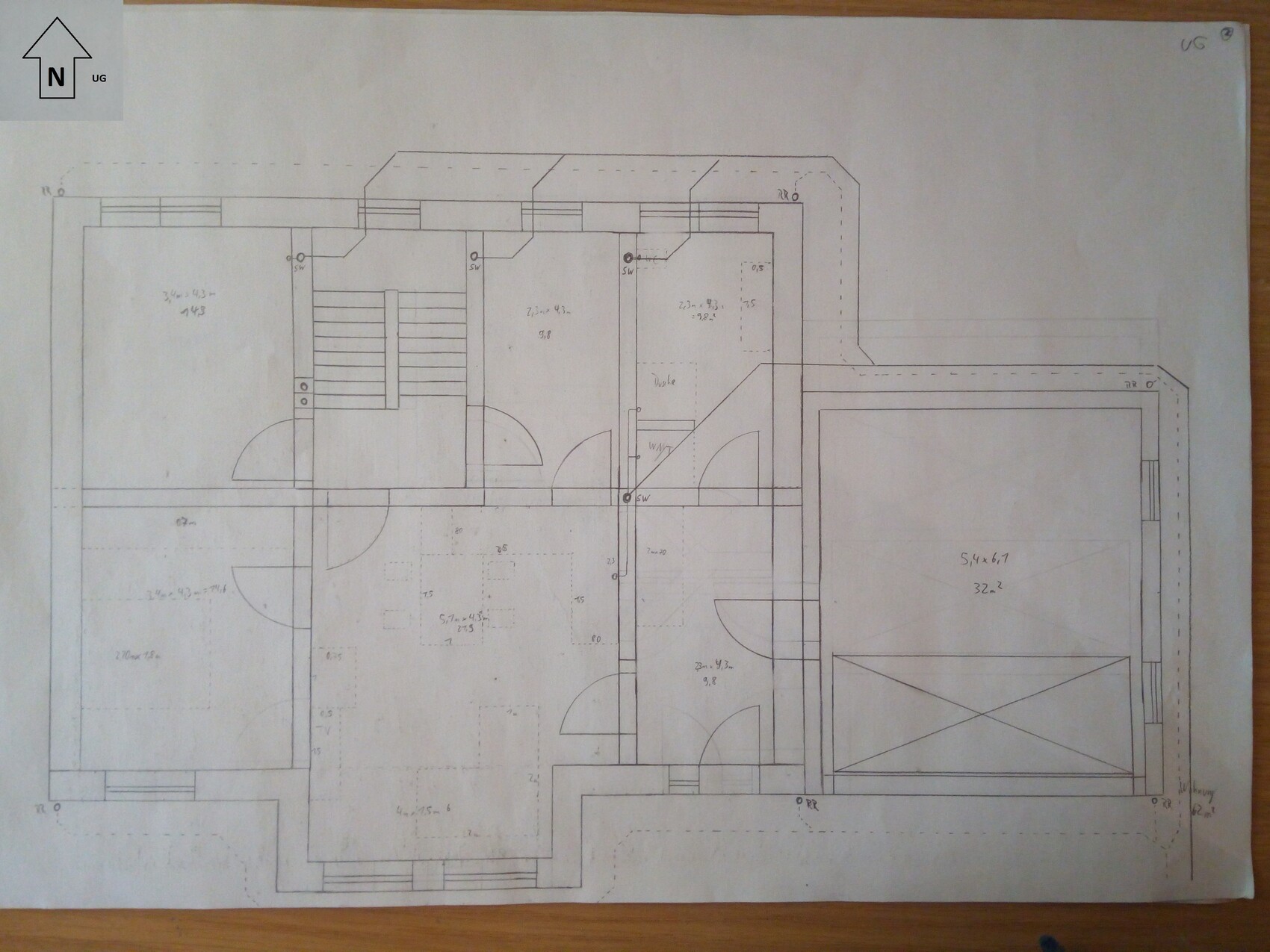 Detailed hand-drawn floor plan with stairs, rooms, and garage