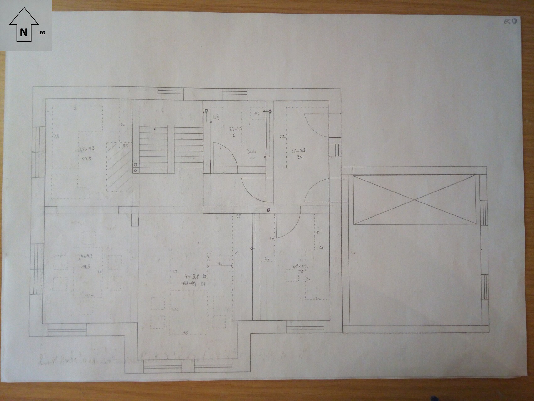 Floor plan of a building with multiple rooms, doors, and stairs.