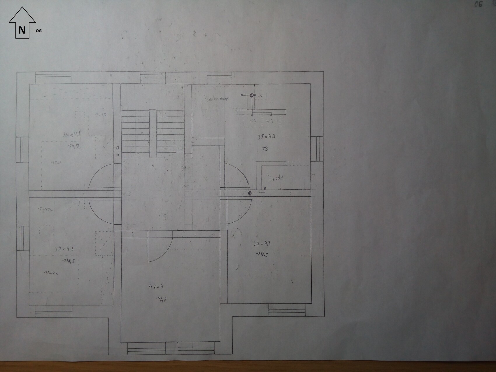 Hand-drawn floor plan of a house with stairs, walls, and doors laid out in the plan