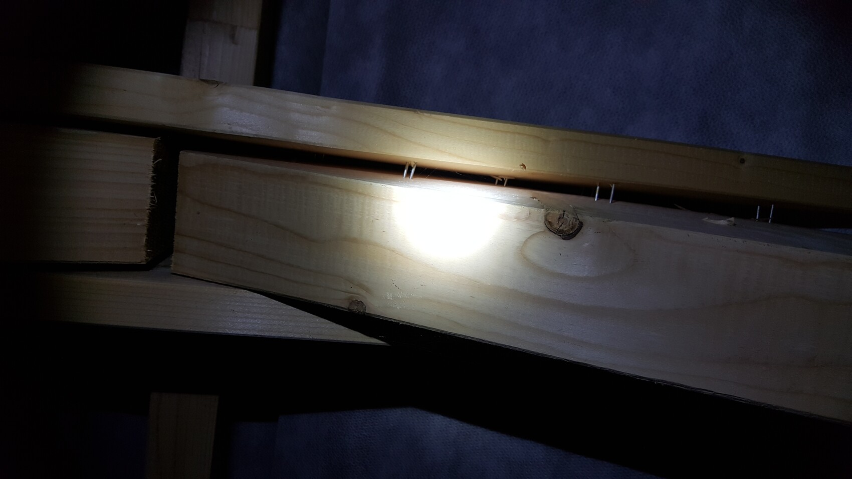 Close-up of wooden beams in the shell with nails