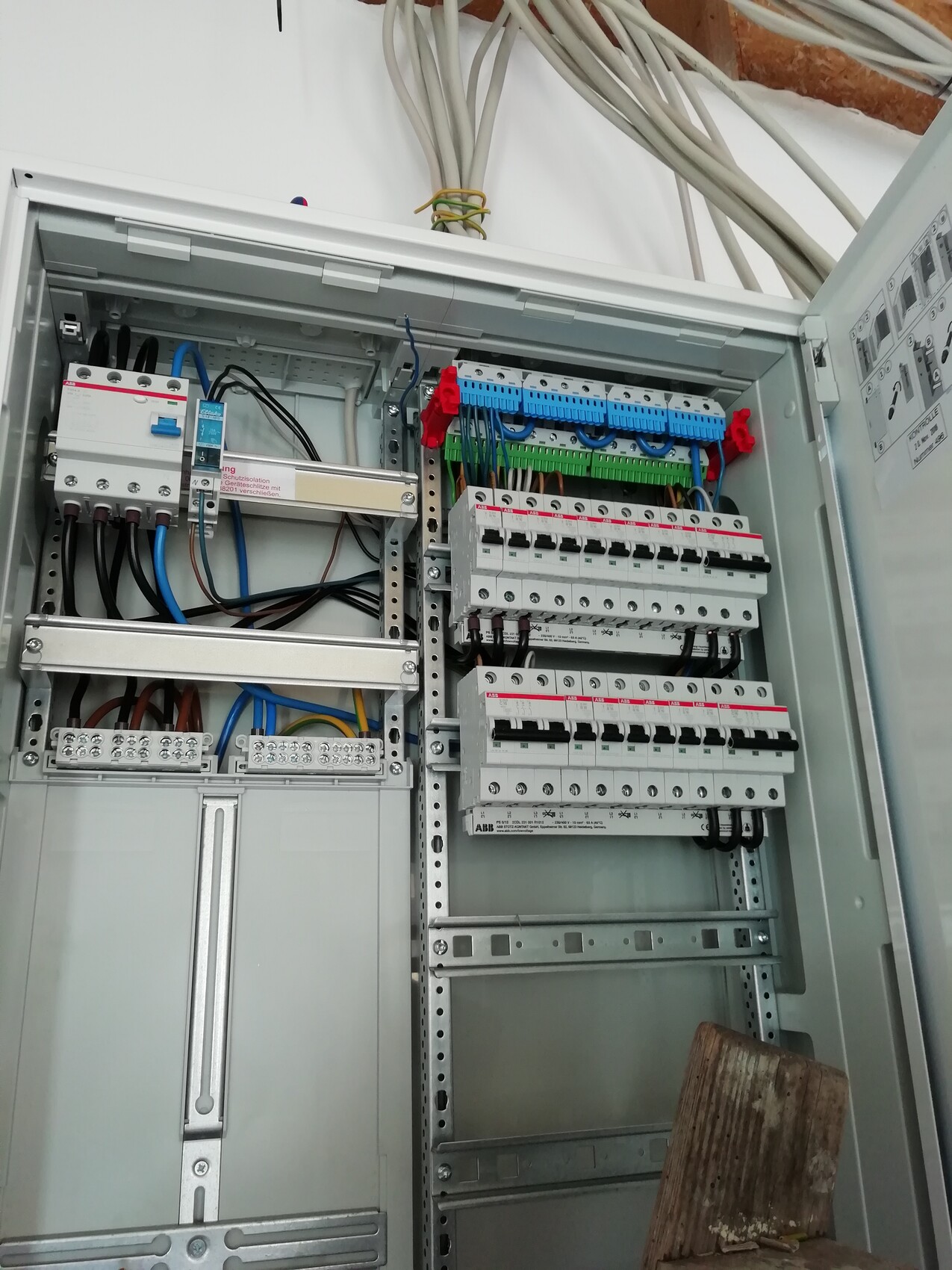 Distribution cabinet with circuit breakers, terminal strips, and wiring