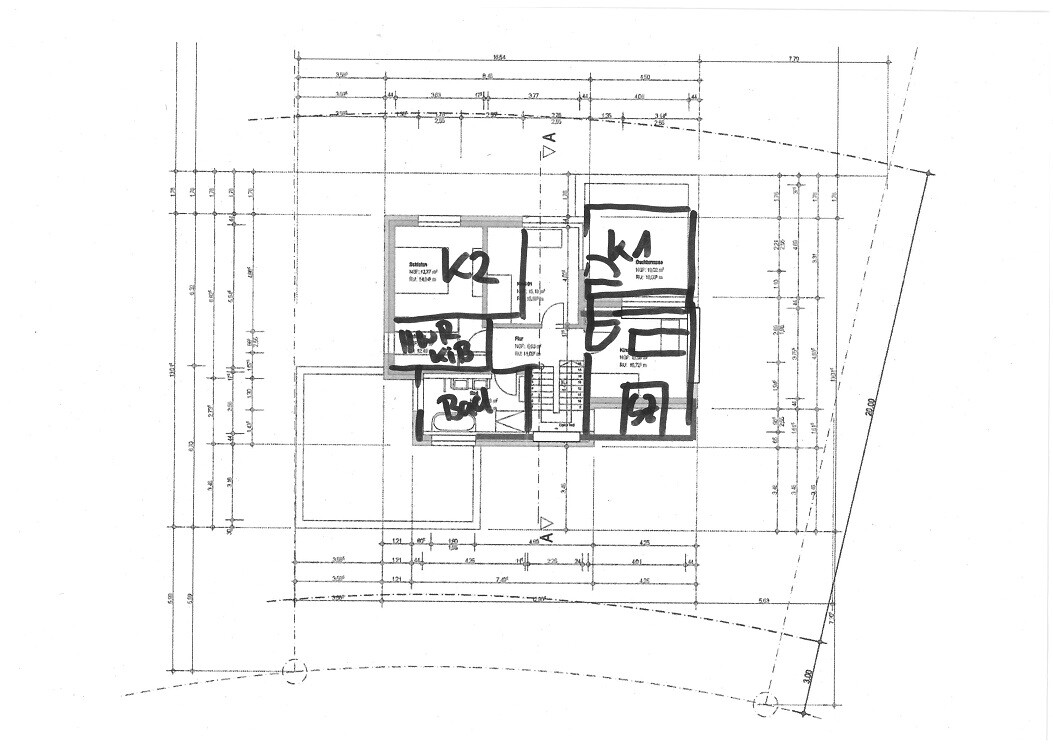 Architectural floor plan of a building with interior rooms, staircase, and dimension lines