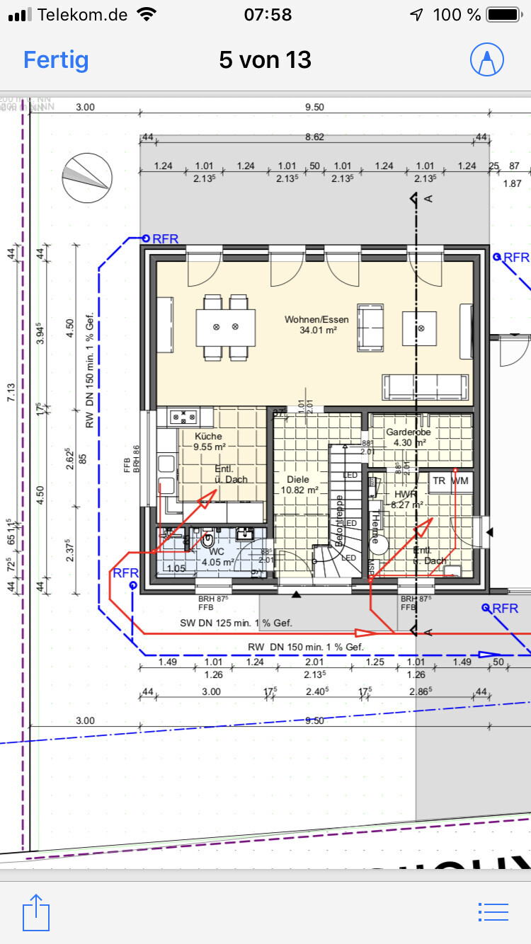 Floor plan of a house with living room, dining area, kitchen, hallway, cloakroom, toilet, and stairs.