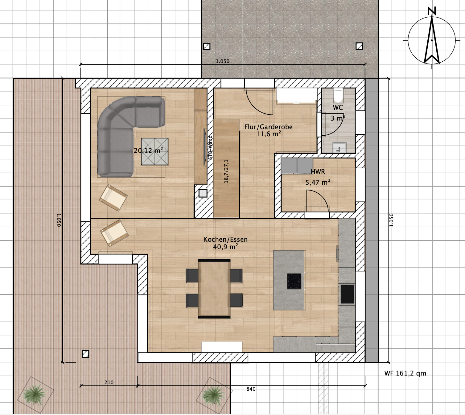 Floor plan of a house: Open kitchen/dining area, living room, hallway/wardrobe, toilet, utility room, terrace.