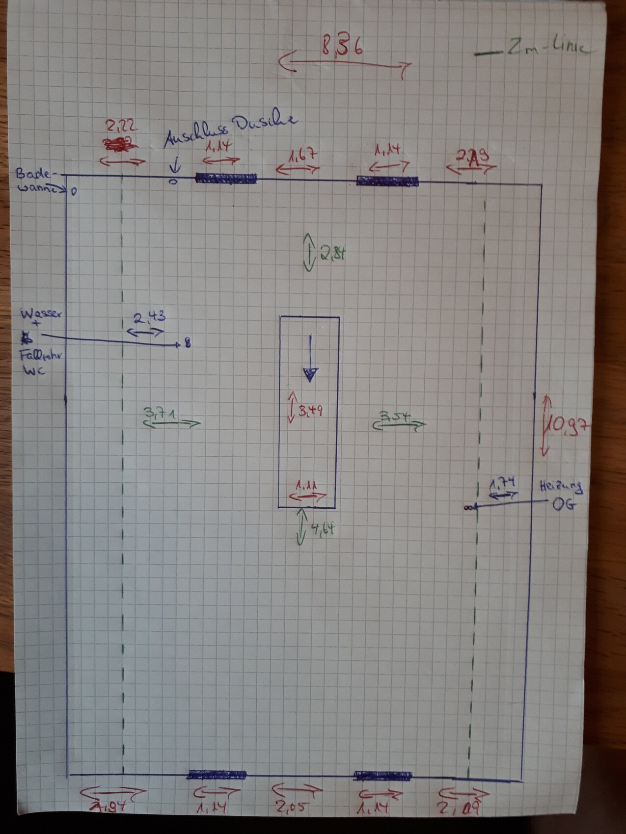 Hand-drawn floor plan of a bathroom with bathtub, shower, toilet, and dimensions.