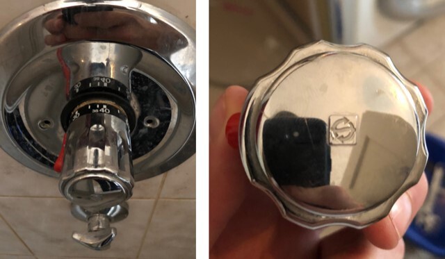Close-up of a silver bathroom faucet with a rotary knob and shiny cover