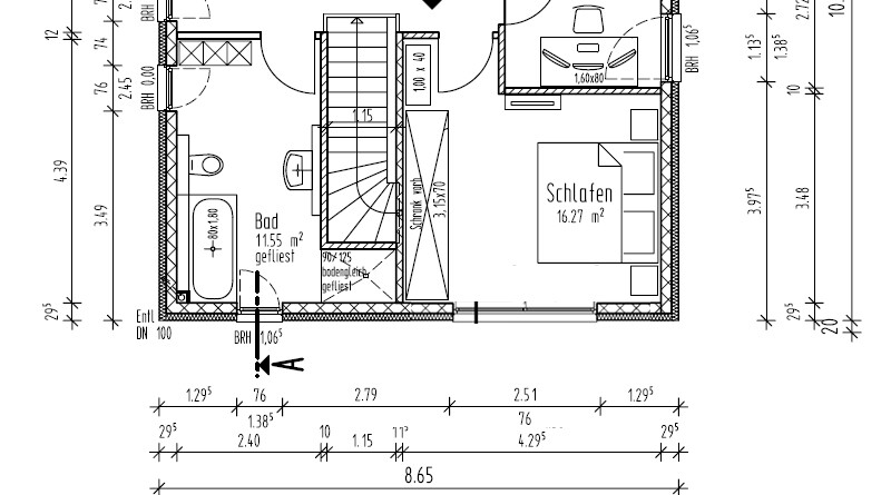 Floor plan of a house with a staircase in the middle, bathroom on the left, bedroom on the right, garage above.