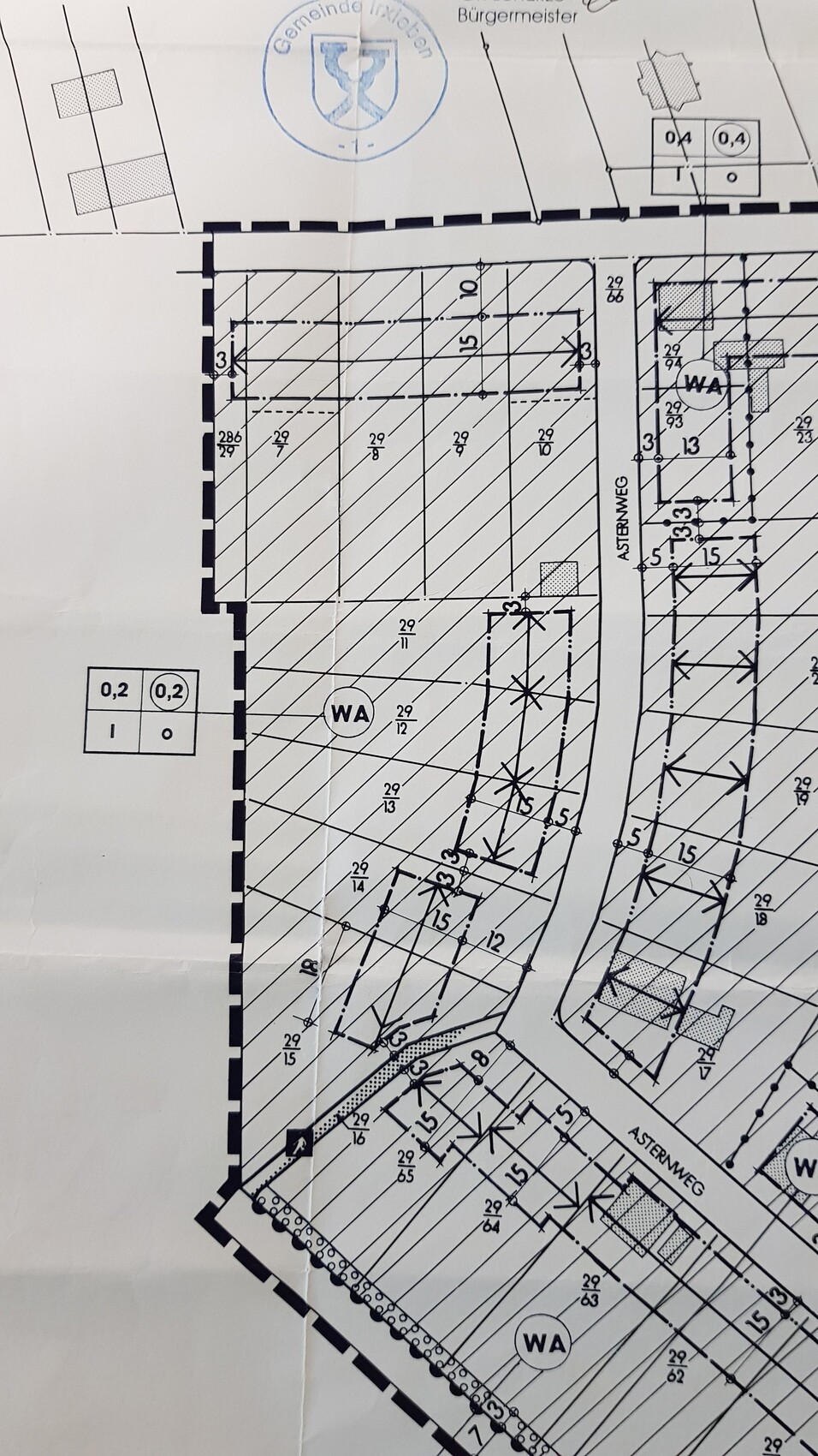 Site plan of a residential area with road layout, WA markings, dimension lines, and municipal stamp.