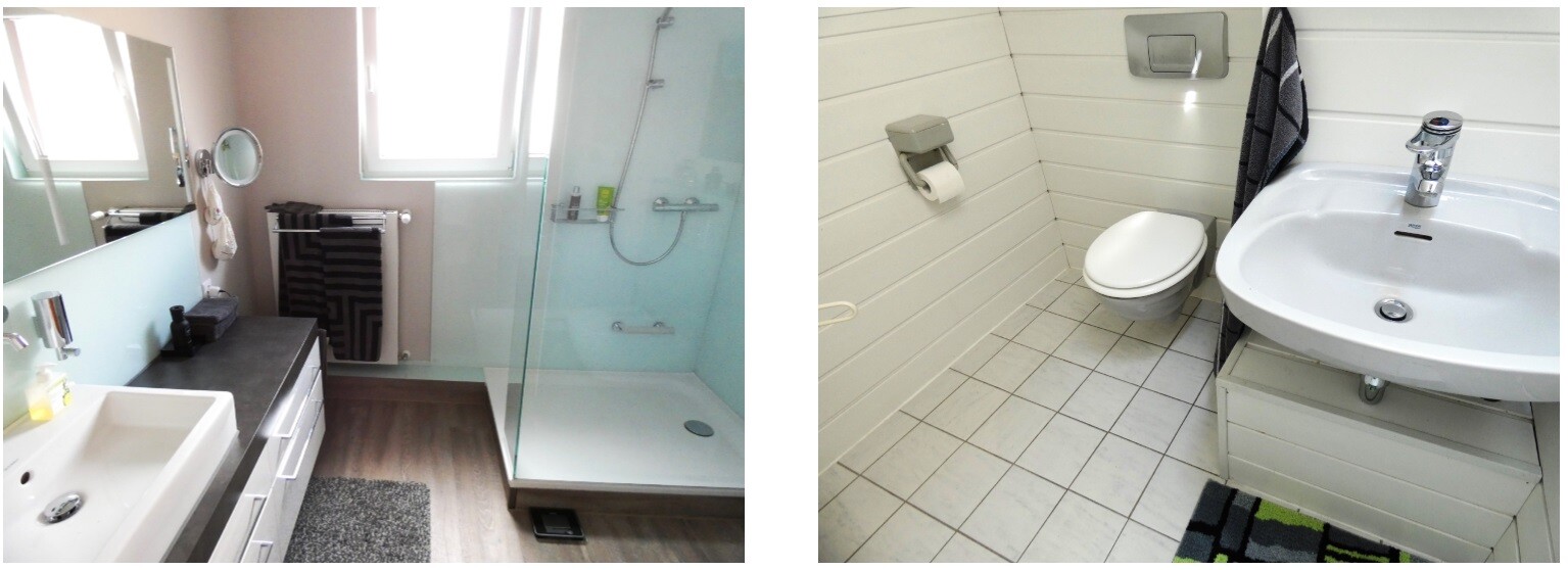 Modern bathroom with glass shower, sink, mirror, towel warmer and toilet.