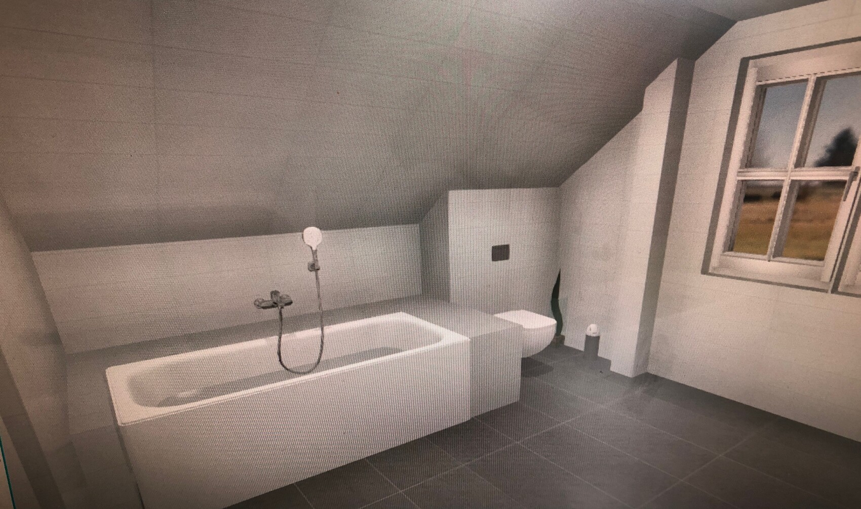 Badezimmer mit langer Badewanne, Duschkopf am Rand, graue Fliesen und Fenster mit Blick nach draußen.