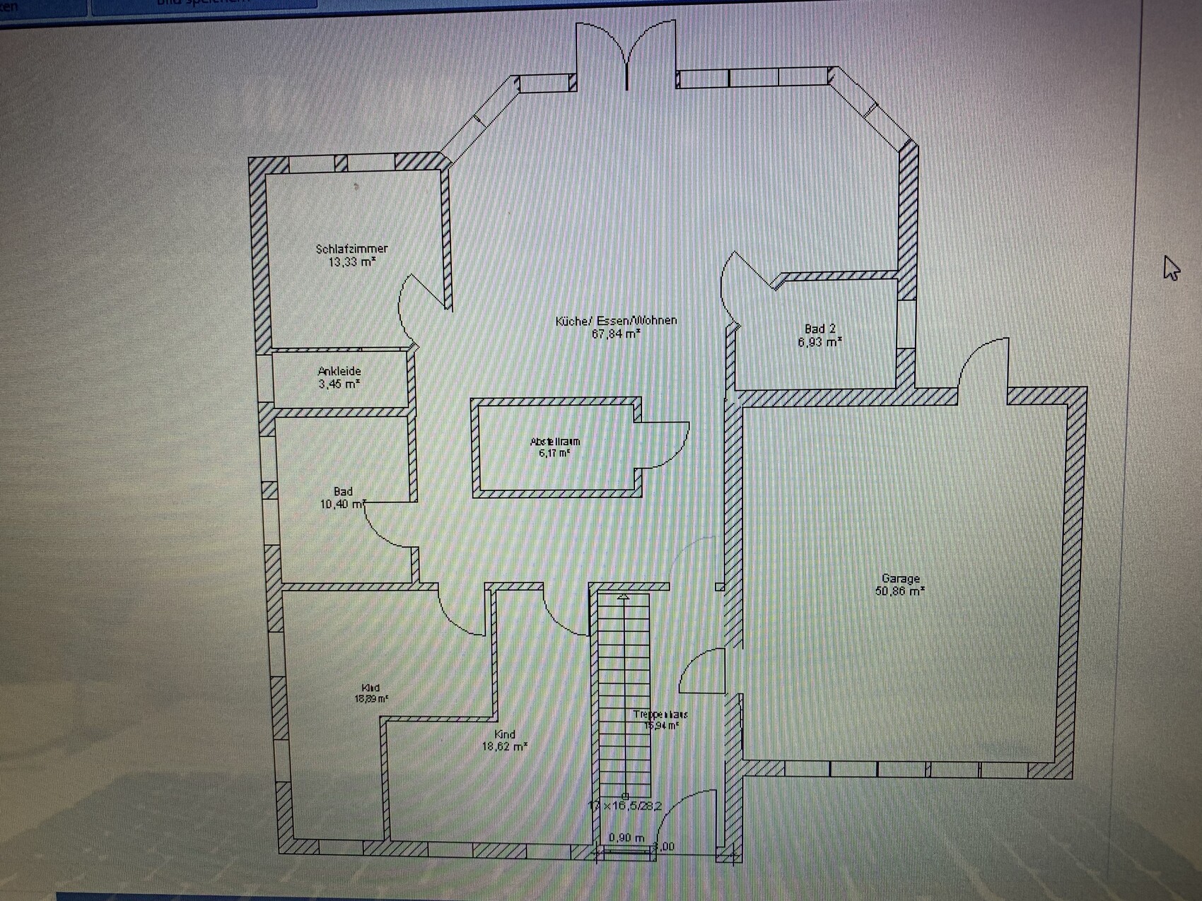 Floor plan of a house with bedroom, kitchen/living area, bathroom, dressing room, garage.