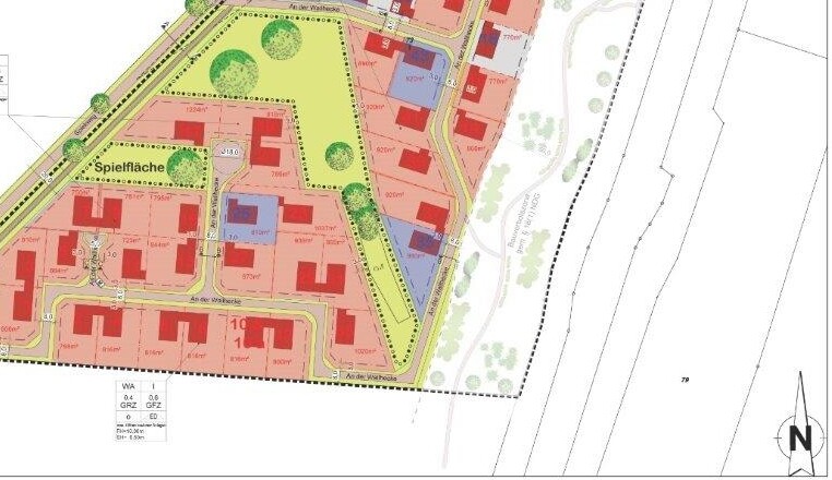 Site plan of a residential area with plots, streets, buildings, and a playground