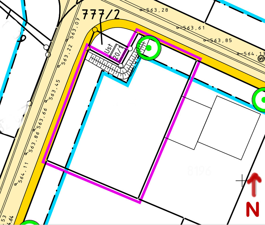 Site plan of a building plot with boundary lines, buildings, and colorful markings