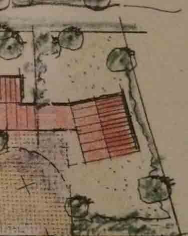 Hand-drawn site plan with building area, garden area, and trees.