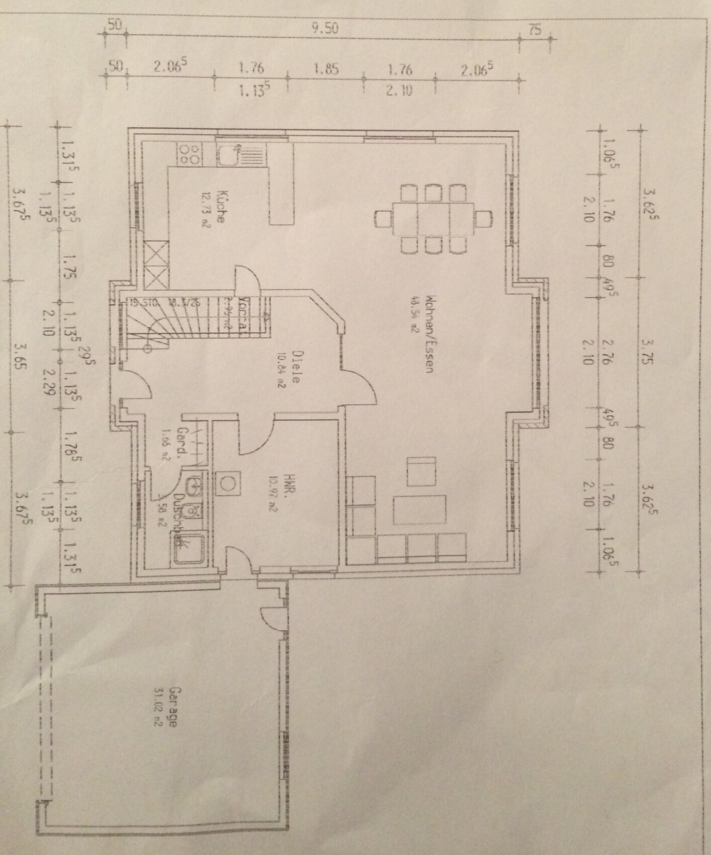Floor plan of a house: kitchen, living/dining room, hallway, bathroom, utility room, cloakroom, garage
