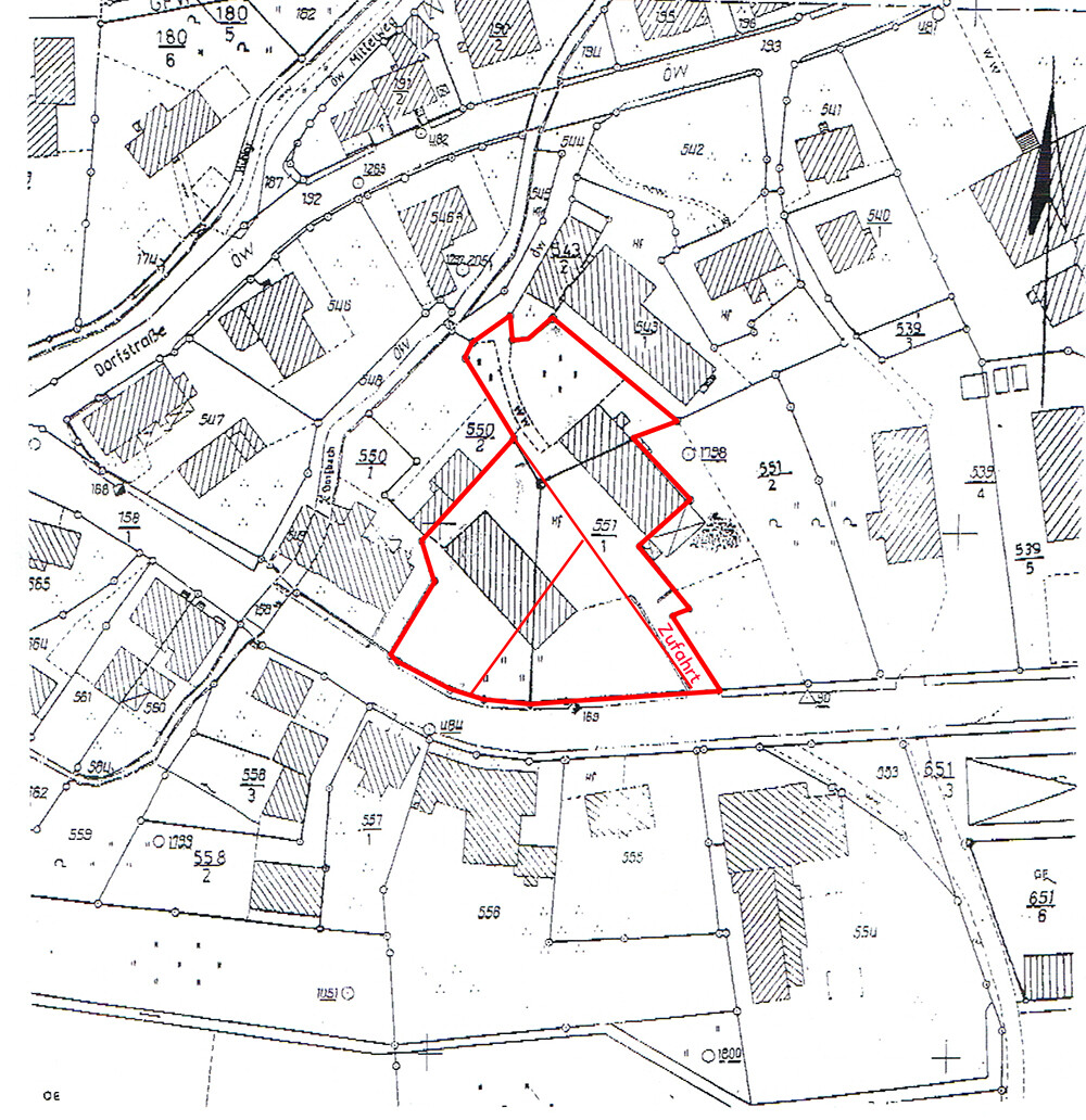 Cadastral map: red border marks a plot of land; street layout and access visible.