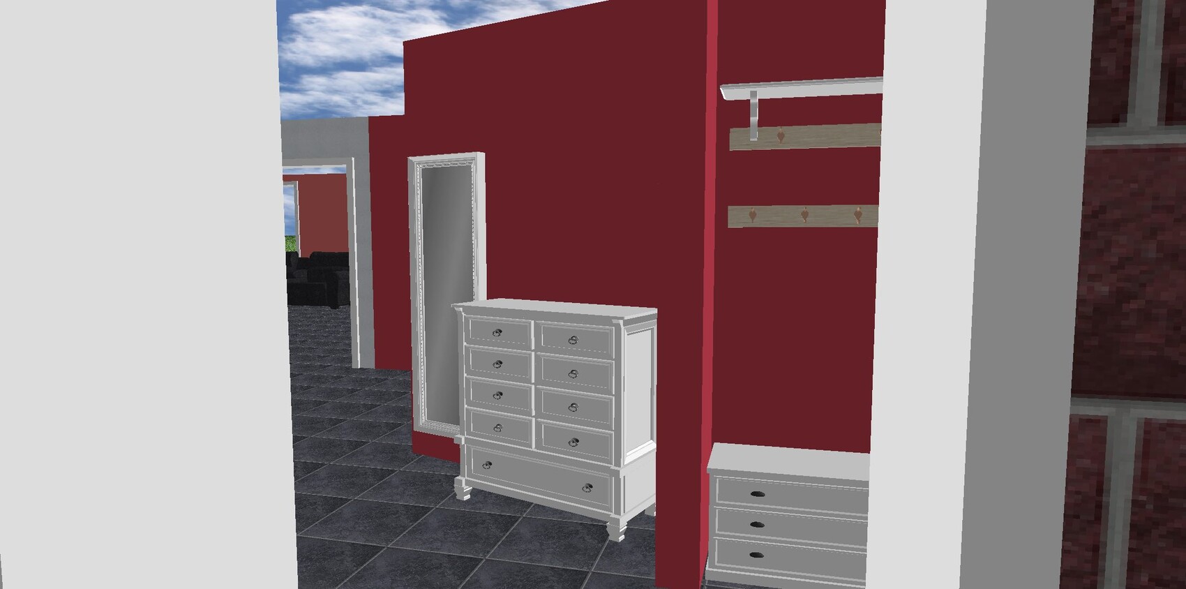 Red wall, freestanding mirror and white chests, coat hooks, dark tiled floor.