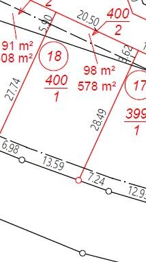 Site plan of a plot with parcel boundaries, dimensions and red markings