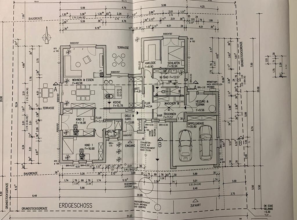 Ground floor plan of a house with terraces, rooms and garage.