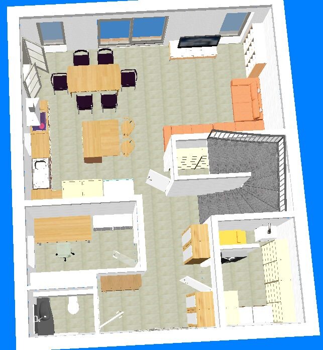 Floor plan of an open living and dining area with kitchen, dining table, sofa and stairs.