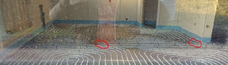 Underfloor heating mats installed inside the building on the floor.