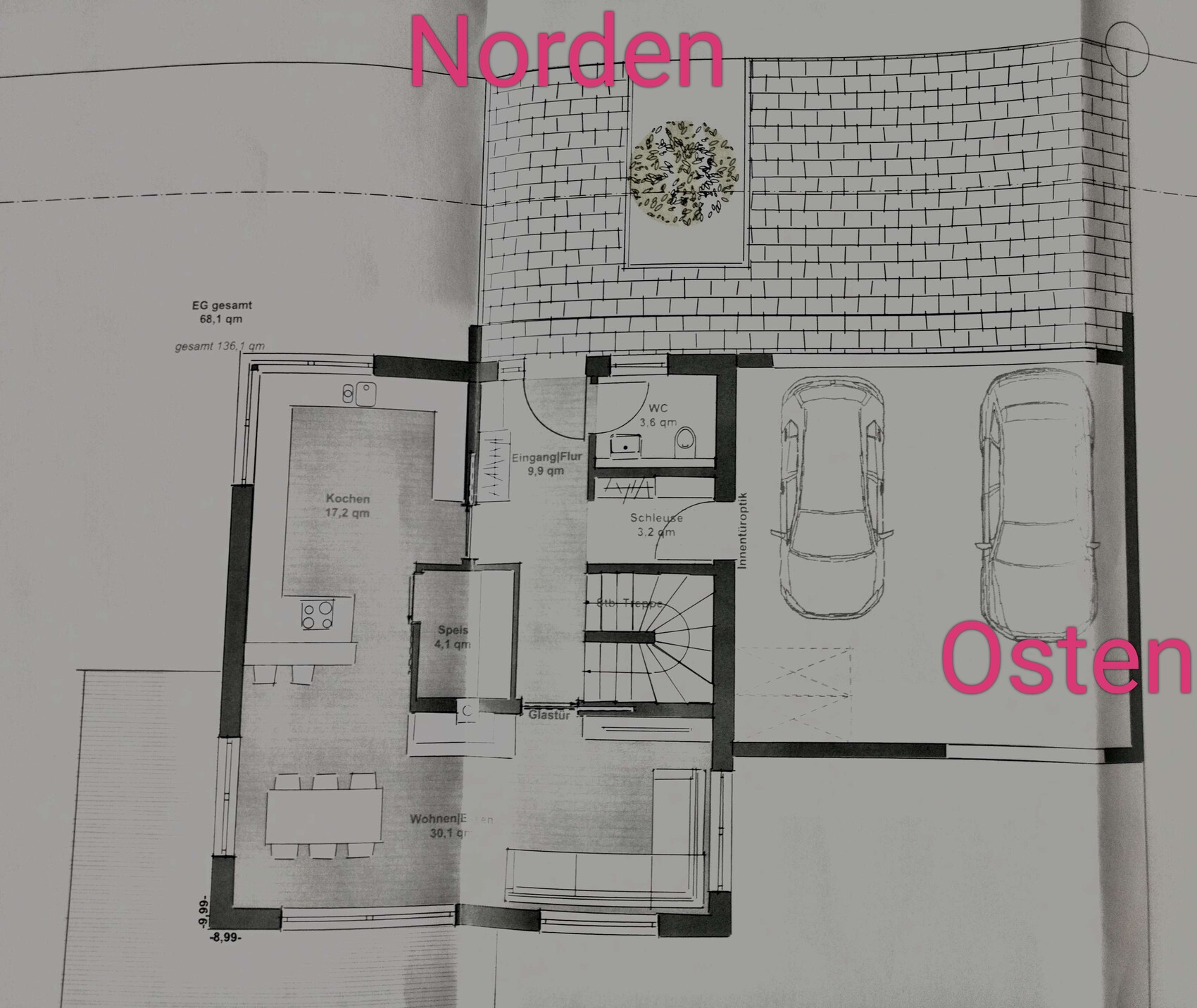 Floor plan of a house with kitchen, living room, hallway and garage; north top, east right.