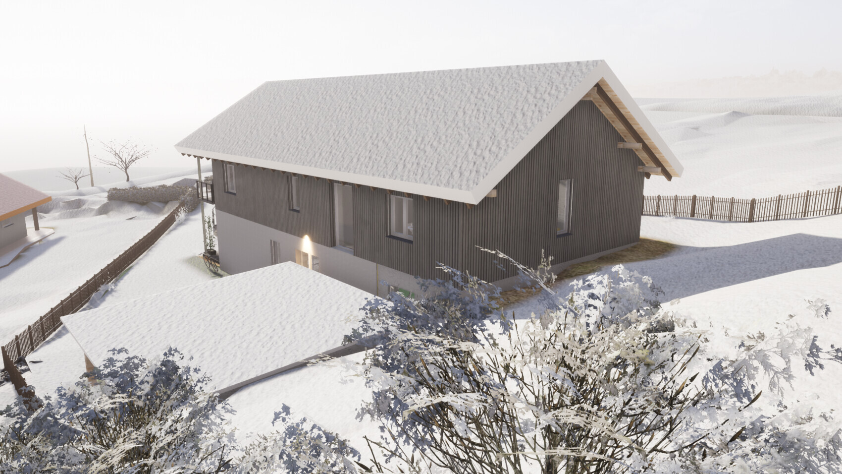 Dark wooden house with snow-covered roof in snowy winter landscape, fences and bushes.