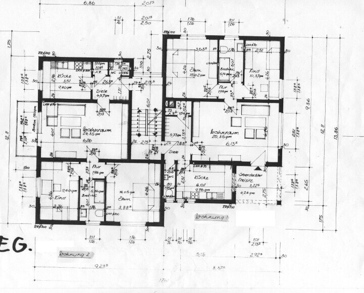 Architectural floor plan of a building with multiple apartments, rooms, and dimensions.
