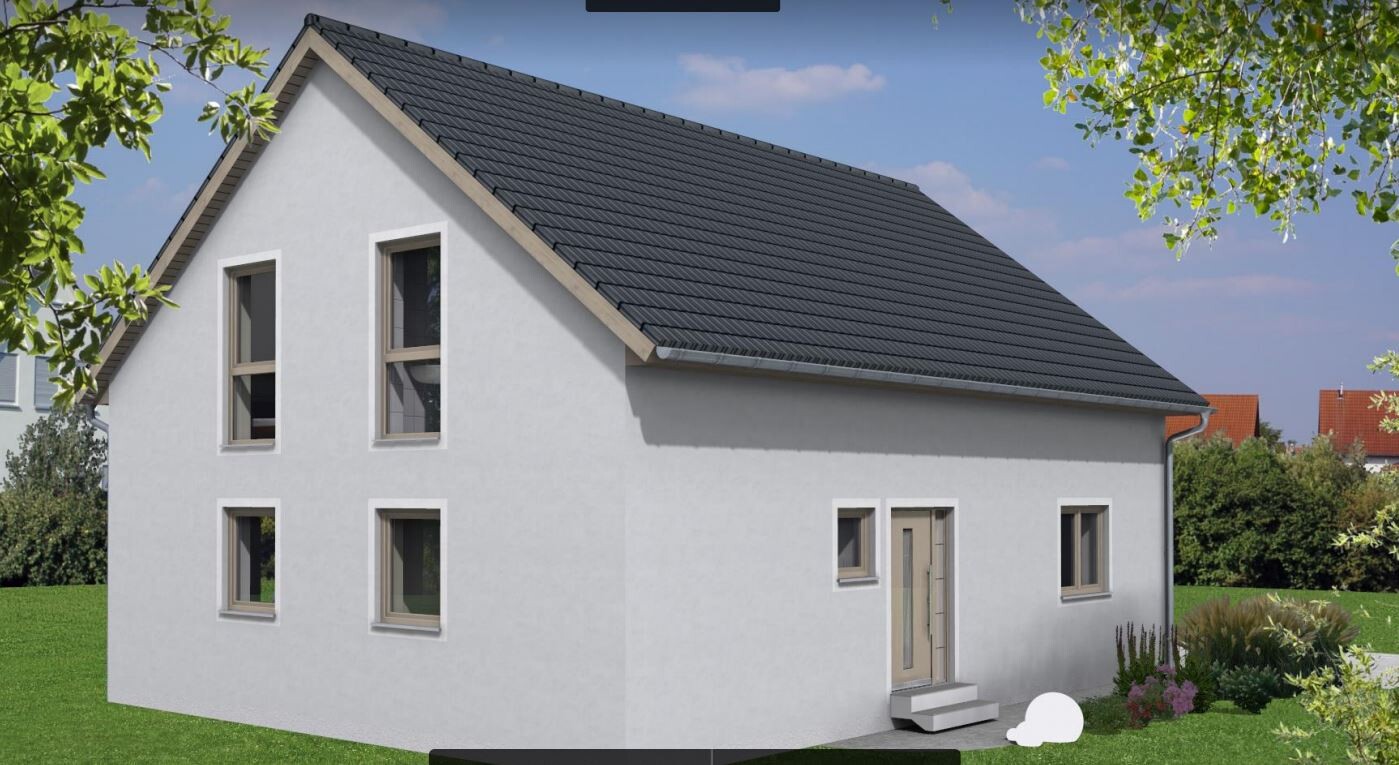 White single-family house exterior view with dark tiled roof, windows, and garden