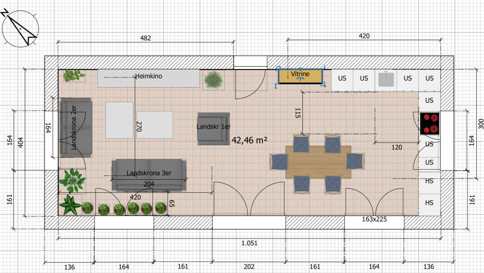Open living and dining area with sofa set, dining table, display cabinet, kitchen unit and plants