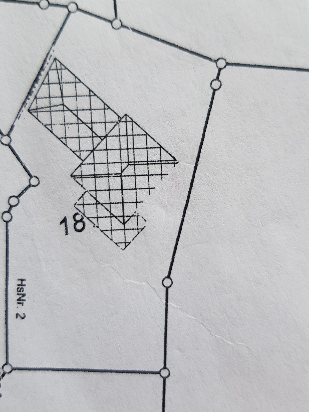 Schematic drawing of a network with nodes and shaded inner polygon.