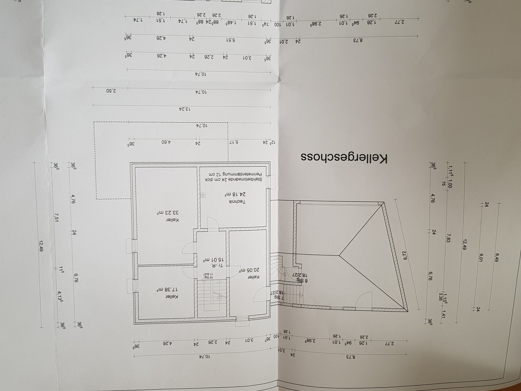 Basement floor plan with cellar rooms, stairs, and garage with gable roof.
