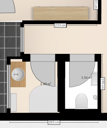 2D floor plan: small bathroom with washbasin on the left and toilet on the right, doors opening