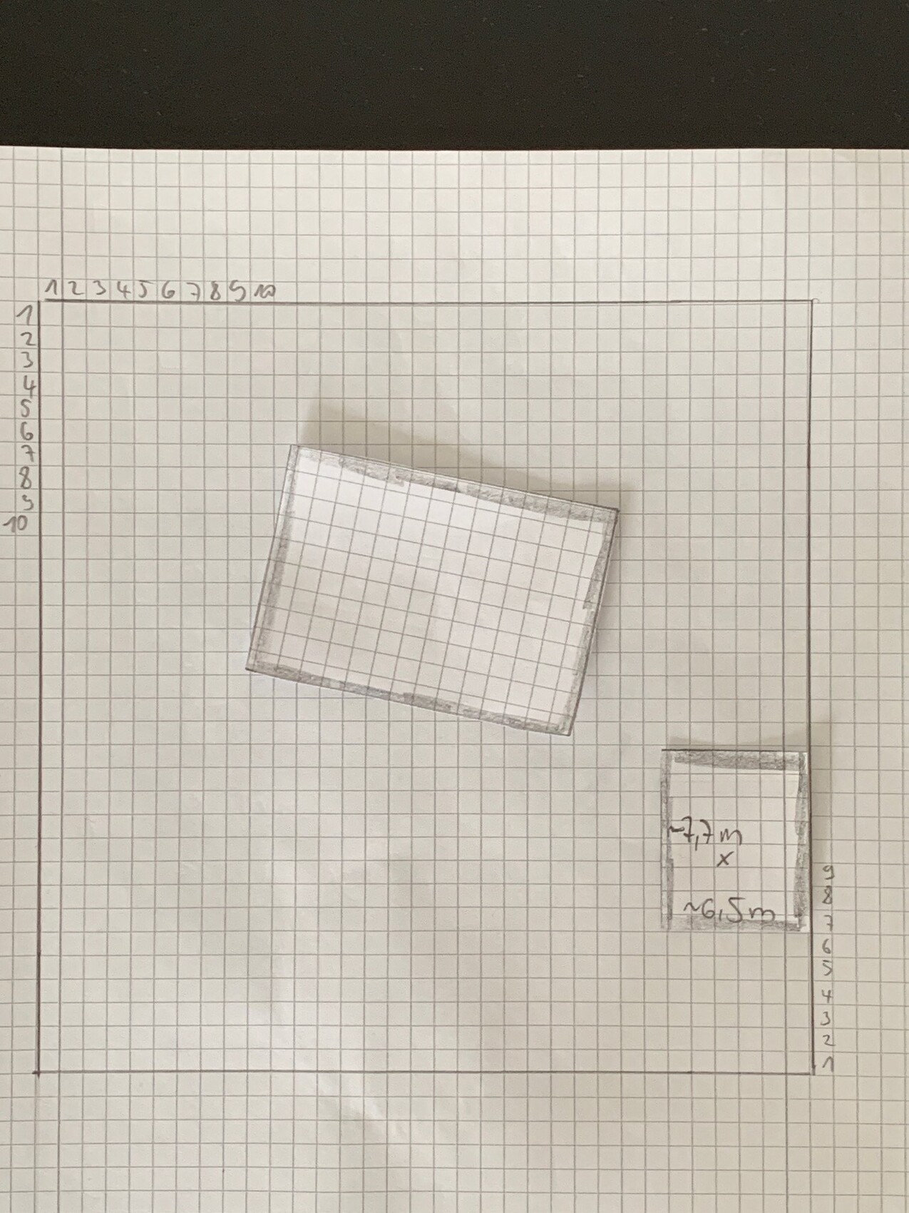 Sketch on graph paper: slanted large rectangle on the left, small rectangle on the bottom right.