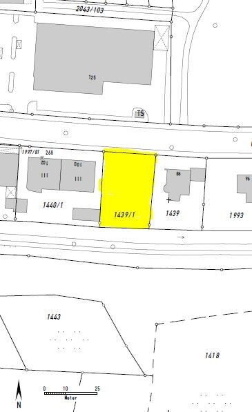 Yellow highlighted plot 1439/1 on a cadastral map next to parcels along a street.