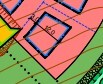 Color-coded site plan map with parcels and building footprints.
