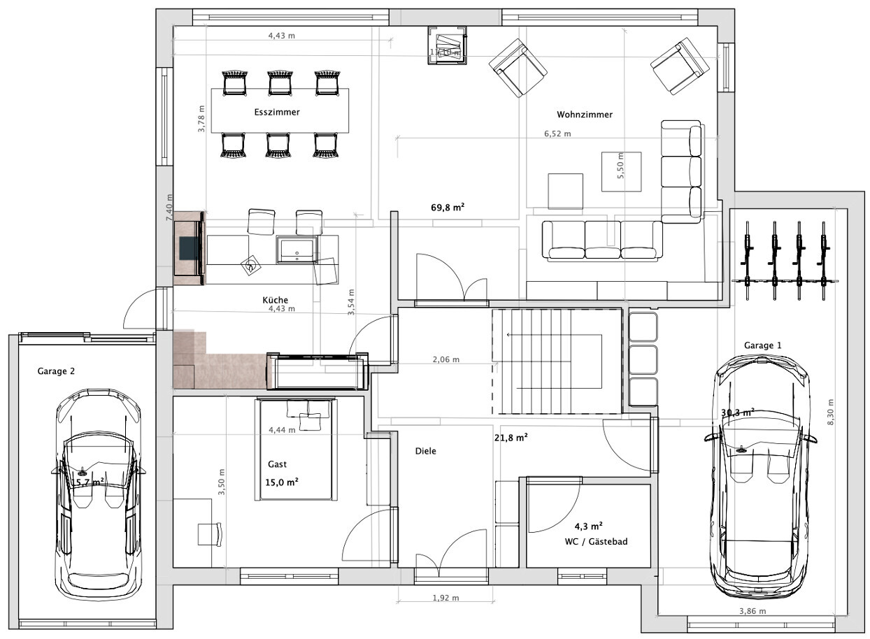 Floor plan of a house with kitchen, dining room, living room, guest room, hallway, WC, and two garages
