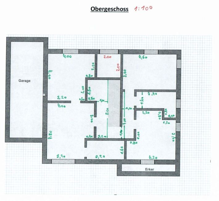 Upper floor plan with garage on the left, several rooms, and a bay window.